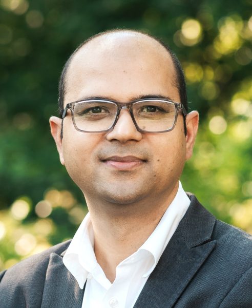 headshot of man with glasses