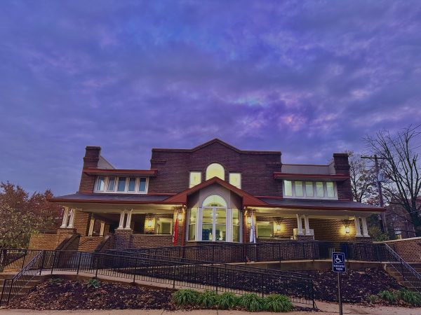 Brick building under purple night sky.