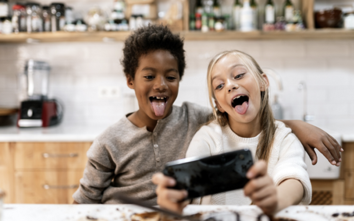 It is not uncommon to see children playing on cell phones. Photo by TechBuzz by AT&T