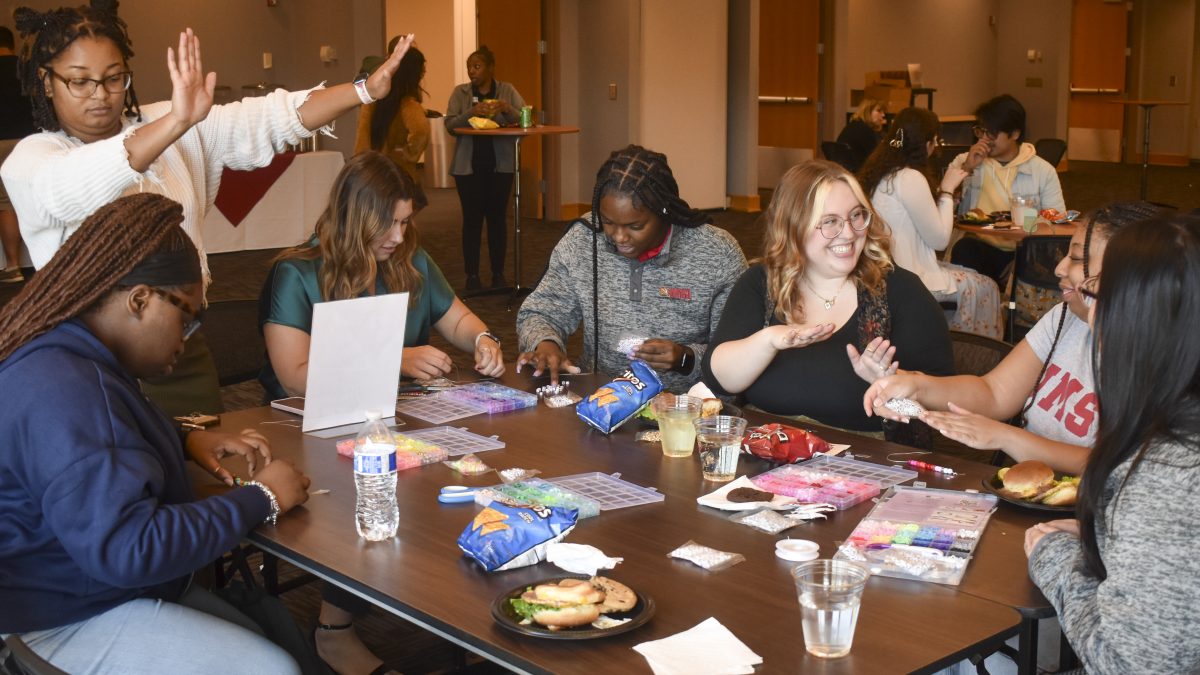 From left to right: Linae Stuart, Corlia Spears, Allison Hermsath, Zariah Ware, Bailey Farrar, Tyler Smith, and Linh Mach making bracelets at the Stress Less Fest held by UMSL Student Outreach and Support, St Louis, Oct 2, 2024.