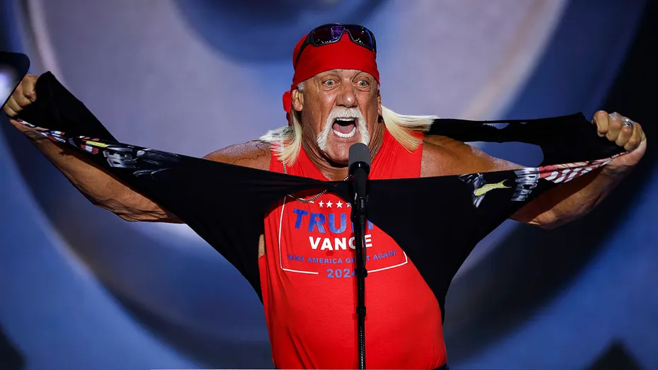 Hulk Hogan ripping off a black shirt to reveal a red Trump shirt underneath.