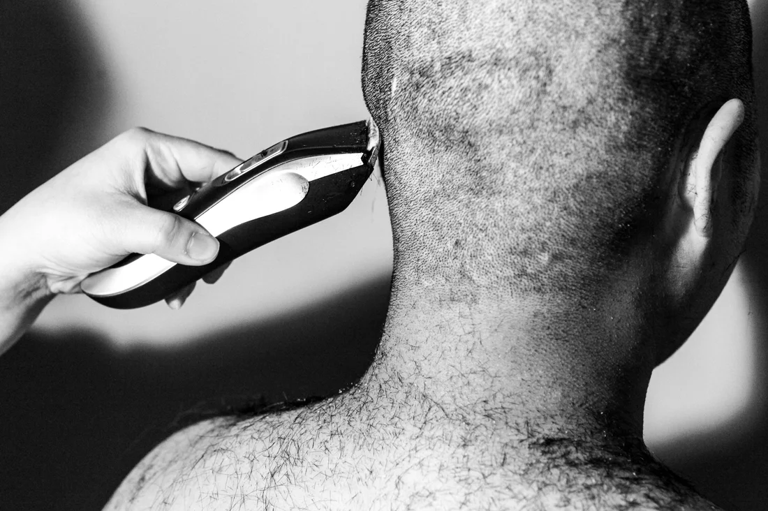 A South Korean women shaving her head as a symbol of the escape the corset movement.