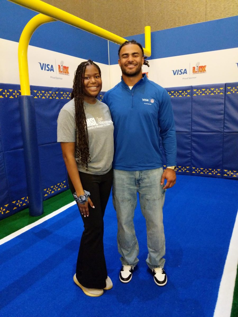 Lauryn Sanders next to Fred Warner at Super Bowl 59