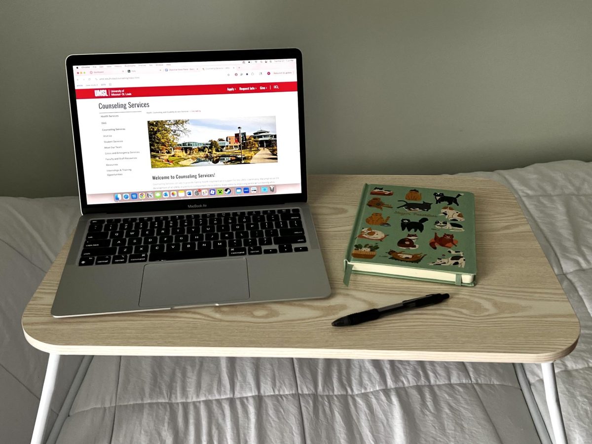 Study desk with UMSL Counseling Services website 